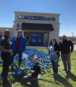 team picture in front of bank