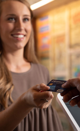 woman using debit card
