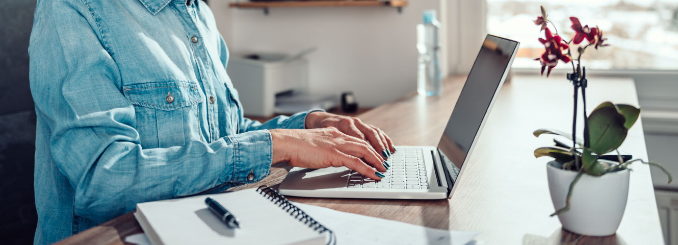 someone typing on computer keyboard