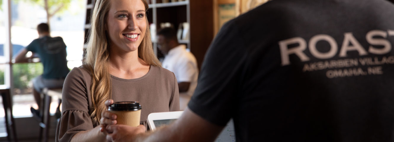 woman buying coffee