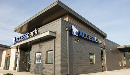 Access Bank branch location with logo on front and side of the building.