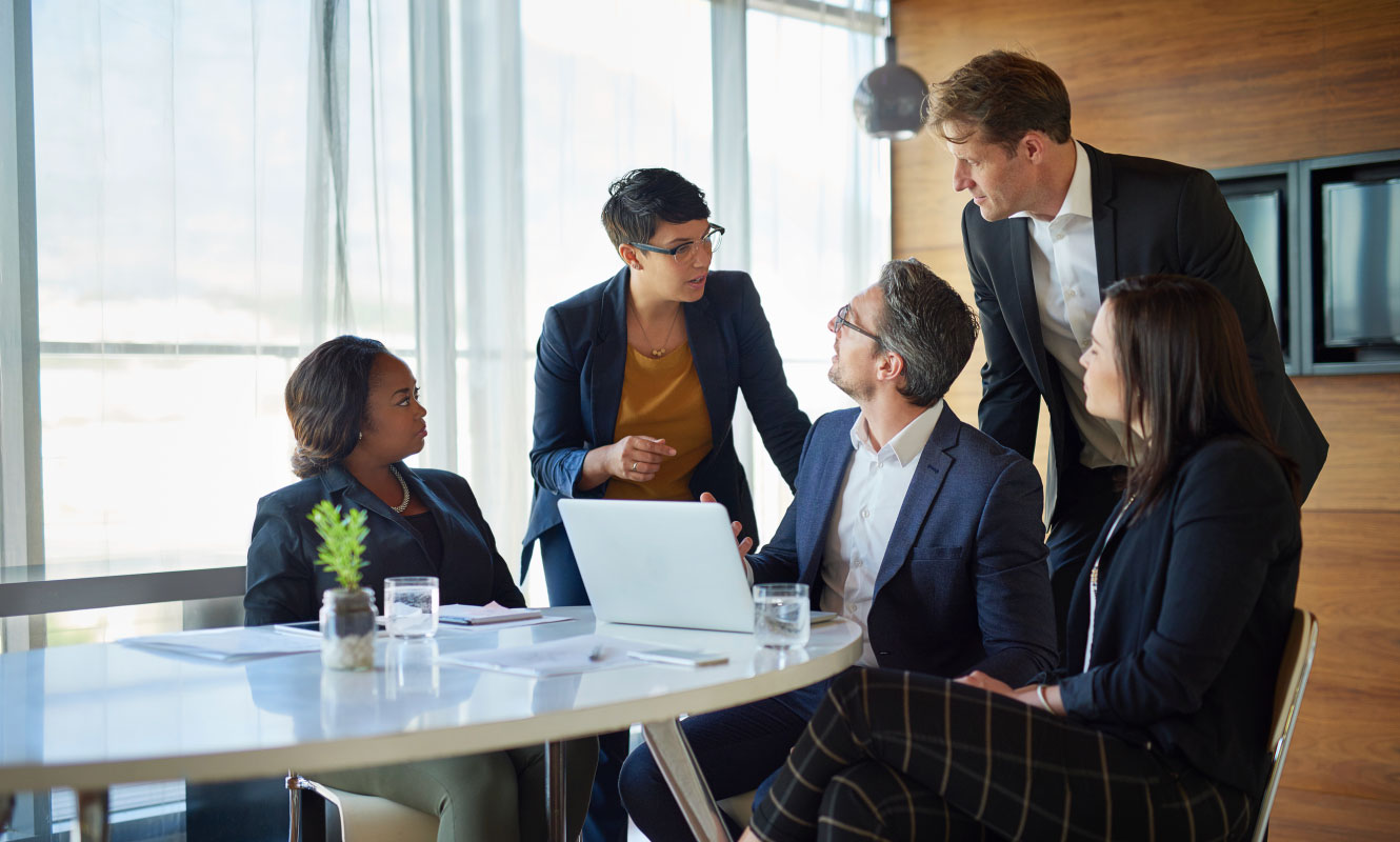 group of people around a desk