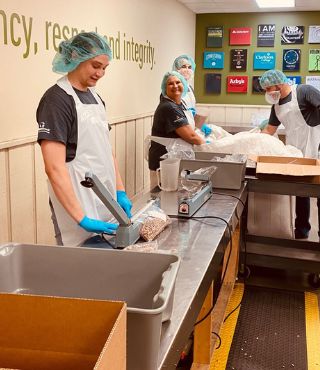 ACCESSBank team packed meals for those in need at the Food Bank of the Heartland.