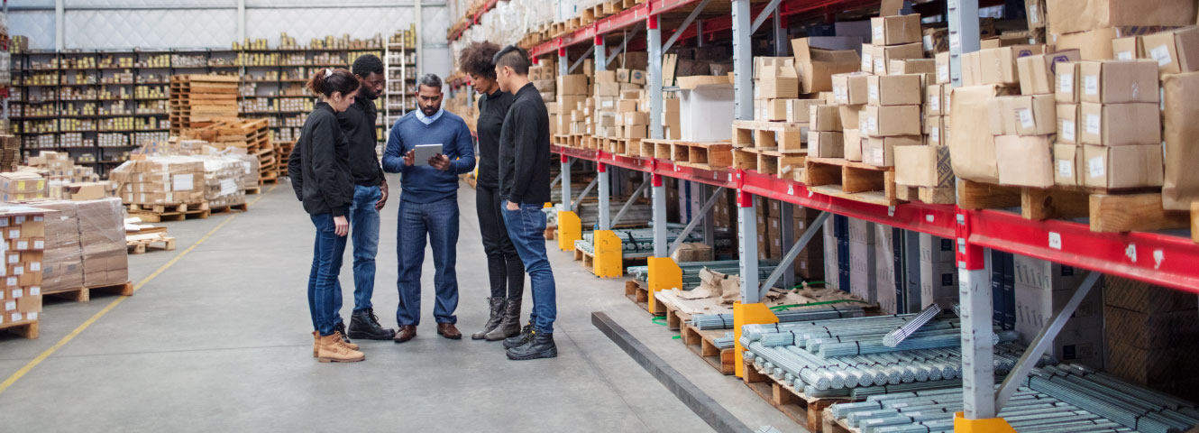 group of people in a warehouse