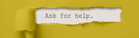 Yellow paper with a rip in the middle that shows "Ask for help".