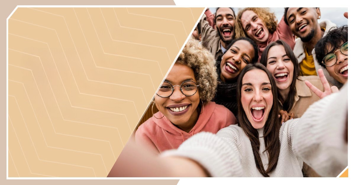 A group of people posing and taking a selfie.
